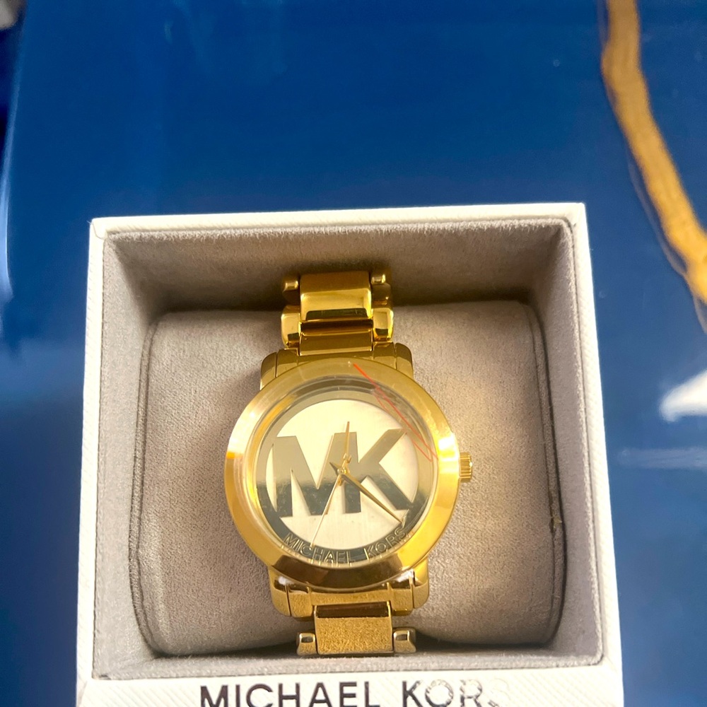Brand New Michael Kors Women’s Gold watch.  New, plastic still on the face